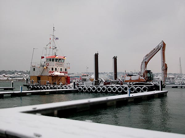 Dredging continues in the snow at Cowes.