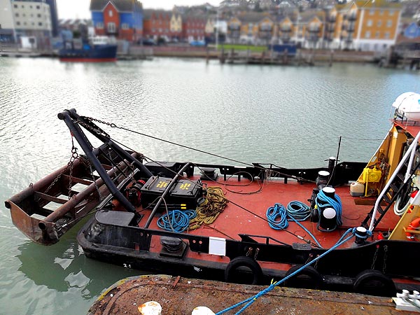 Dredging continues in the snow at Cowes.